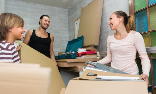 House movers loading furniture in Queens Park