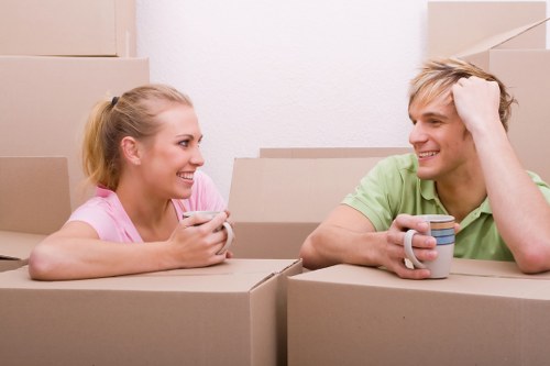 Packed boxes and furniture ready for loading into a van