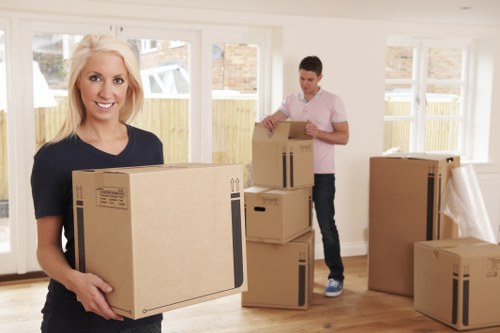 A van loading household items for a Queenspark move