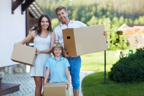 Professional Man and Van Queenspark team handling belongings with care during a local move
