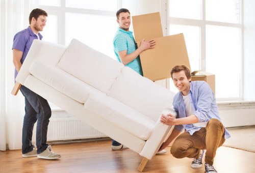 Carefully loaded moving boxes and furniture for transport