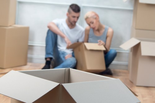 Boxes and furniture being carefully handled during transport