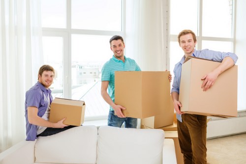 Moving day logistics in Queens Park including loading, transport, and room placement