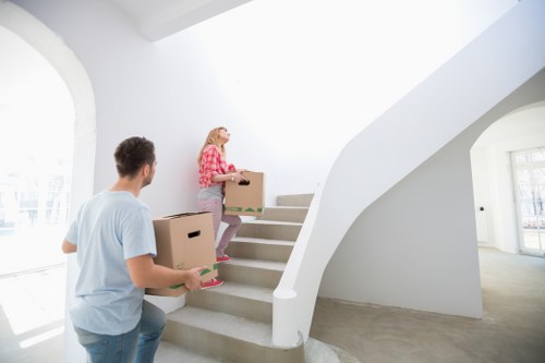 Loading furniture into a van for a Queens Park move
