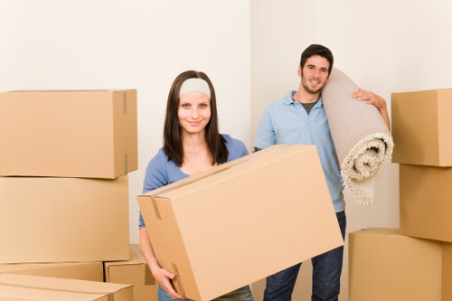 Furniture and boxes being handled during a house move in Queens Park