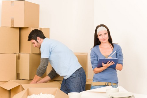 Packed boxes and furniture ready for a home removal service