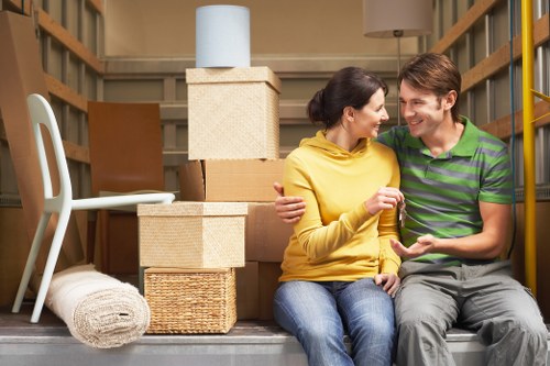 Homeowner preparing boxes for a Queens Park house move